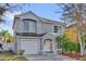 Charming two-story home with a well-maintained lawn and mature trees at 2450 Parsons Pond Cir, Kissimmee, FL 34743