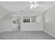 Bright and airy living room featuring tile flooring and arched doorways at 2450 Parsons Pond Cir, Kissimmee, FL 34743