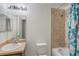 Bright bathroom featuring a sink, toilet, bathtub and shower at 251 Tower View W Dr, Haines City, FL 33844