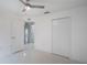 Well-lit bedroom featuring a ceiling fan, access to an en suite, and closet at 251 Tower View W Dr, Haines City, FL 33844