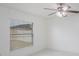 Clean bedroom with a ceiling fan and a bright window offering plenty of natural light at 251 Tower View W Dr, Haines City, FL 33844