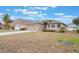 Charming single-story home featuring tan siding, well-maintained lawn and a two car attached garage at 251 Tower View W Dr, Haines City, FL 33844