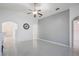 Open living room with a ceiling fan and a decorative fireplace at 251 Tower View W Dr, Haines City, FL 33844