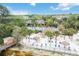 Beautiful aerial view of the community beach with a sandy shoreline, palm trees, and a swimming pool at 313 Lucaya Loop # 313, Davenport, FL 33897