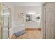 Bright bathroom with a tub, a separate shower, dual sinks, and modern fixtures at 313 Lucaya Loop # 313, Davenport, FL 33897