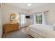 Bright bedroom with a comfortable bed, wood floors, and sunny windows at 313 Lucaya Loop # 313, Davenport, FL 33897