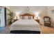 Serene bedroom with a comfortable bed, a plant, matching nightstands, and a calming atmosphere at 313 Lucaya Loop # 313, Davenport, FL 33897