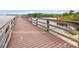 Community dock with a wooden walkway out to the peaceful lake and wildlife at 313 Lucaya Loop # 313, Davenport, FL 33897