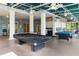 Community game room featuring two pool tables, an outdoor feel and great for entertaining at 313 Lucaya Loop # 313, Davenport, FL 33897