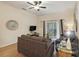 Inviting living room with comfortable seating, a glass coffee table, and access to a private balcony at 313 Lucaya Loop # 313, Davenport, FL 33897