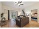 Inviting living room featuring a comfortable sofa and a balcony with outdoor views providing a relaxing atmosphere at 313 Lucaya Loop # 313, Davenport, FL 33897