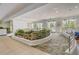 Community lobby with pond and seating area at 313 Lucaya Loop # 313, Davenport, FL 33897