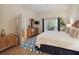 Comfortable main bedroom with a king bed, a dresser, an en-suite bathroom, and access to the balcony at 313 Lucaya Loop # 313, Davenport, FL 33897