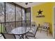 Enjoy relaxing on this screened porch with seating and outdoor views at 313 Lucaya Loop # 313, Davenport, FL 33897
