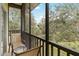Outdoor seating on a relaxing screened-in porch with a lovely view at 313 Lucaya Loop # 313, Davenport, FL 33897