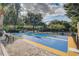 Outdoor shuffleboard area in the community with palm trees and benches at 313 Lucaya Loop # 313, Davenport, FL 33897
