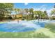 Community splash pad featuring vibrant play structures, tables and lush landscaping at 313 Lucaya Loop # 313, Davenport, FL 33897