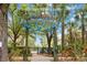 Community splash pad entrance featuring colorful sign, lush landscaping, and secure gated access at 313 Lucaya Loop # 313, Davenport, FL 33897