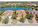 Beautiful aerial view of home, showcasing the lush landscaping and serene lake view at 3390 Fallbrook Dr, Kissimmee, FL 34759