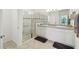 Bathroom featuring double sinks, granite countertops, and glass shower at 3390 Fallbrook Dr, Kissimmee, FL 34759