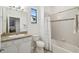 Bathroom featuring a vanity with granite countertop and a shower-tub combination at 3390 Fallbrook Dr, Kissimmee, FL 34759