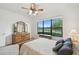 Bedroom with a view of the lake through a large window at 3390 Fallbrook Dr, Kissimmee, FL 34759