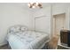 Bedroom showcasing floral bedding, ceiling fan, and a closet for ample storage at 3390 Fallbrook Dr, Kissimmee, FL 34759