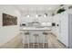 Modern kitchen featuring white cabinets, a tile backsplash, and a convenient center island at 3390 Fallbrook Dr, Kissimmee, FL 34759
