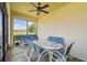 Screened lanai with comfortable seating and views of the water, perfect for relaxation at 3390 Fallbrook Dr, Kissimmee, FL 34759