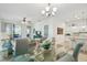 Inviting living space with tile flooring and a view of the dining area and kitchen at 3390 Fallbrook Dr, Kissimmee, FL 34759
