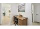 Bright office space featuring a large desk, chair, and a view into the home at 3390 Fallbrook Dr, Kissimmee, FL 34759