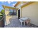 Cozy outdoor patio with stone flooring and a charming four-chair table set at 3390 Fallbrook Dr, Kissimmee, FL 34759