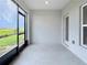 Enclosed back porch with screens and sliding glass doors overlooks the backyard at 345 Sedgewick Dr, Davenport, FL 33837