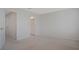A bedroom with carpet and a connecting door to the bathroom at 345 Sedgewick Dr, Davenport, FL 33837