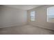 Bedroom featuring carpet floors and windows offering natural light and outside views at 345 Sedgewick Dr, Davenport, FL 33837