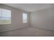 Bedroom featuring carpeted floors and windows offering natural light and a view at 345 Sedgewick Dr, Davenport, FL 33837