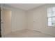 Neutral bedroom featuring light carpet, white walls and trim, a standard closet door at 345 Sedgewick Dr, Davenport, FL 33837