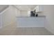 Open-concept kitchen features sleek countertops, modern appliances, and convenient access to other living areas at 345 Sedgewick Dr, Davenport, FL 33837