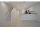 Inviting living area with open-concept design, seamlessly connecting to the staircase and kitchen at 345 Sedgewick Dr, Davenport, FL 33837