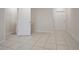 Bright room with neutral walls, tile flooring, and convenient access to bathroom at 345 Sedgewick Dr, Davenport, FL 33837