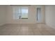Bright room featuring tile flooring, natural light, and seamless transition to the outdoors at 345 Sedgewick Dr, Davenport, FL 33837