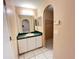 A bathroom featuring a large mirror above the vanity at 401 Talquin Ct, Orlando, FL 32807