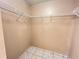 The closet features built in shelving and tiled floors at 401 Talquin Ct, Orlando, FL 32807