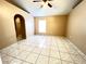 Main bedroom featuring tile flooring, ceiling fan, and walk-in closet at 401 Talquin Ct, Orlando, FL 32807