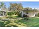 A grassy backyard that includes a shed, a grill, and a beautiful lawn at 401 Woodlawn Ter, Kissimmee, FL 34744
