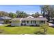 Charming single-story home with a well-maintained lawn and inviting curb appeal at 401 Woodlawn Ter, Kissimmee, FL 34744