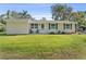 Charming single-story home with a well-maintained lawn and inviting curb appeal at 401 Woodlawn Ter, Kissimmee, FL 34744