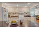 Well-equipped kitchen features white appliances, countertops, and cabinetry, offering a functional culinary space at 401 Woodlawn Ter, Kissimmee, FL 34744