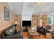 Comfortable living room features classic decor, built-in shelving, and hardwood floors, creating an inviting and stylish ambiance at 401 Woodlawn Ter, Kissimmee, FL 34744