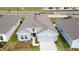 Aerial view of a single-Gathering home showing the home's roof and the well-manicured front lawn at 4211 Little Owl Ln, Kissimmee, FL 34746